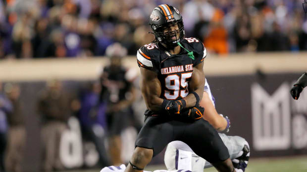 Oklahoma State's Jaleel Johnson (95) celebrates his sack on Kansas State's Will Howard (18) in the first half of the college football game between the Oklahoma State University Cowboys and the Kansas State Wildcats at Boone Pickens Stadium in Stillwater. Okla., Friday, Oct. 6, 2023.  